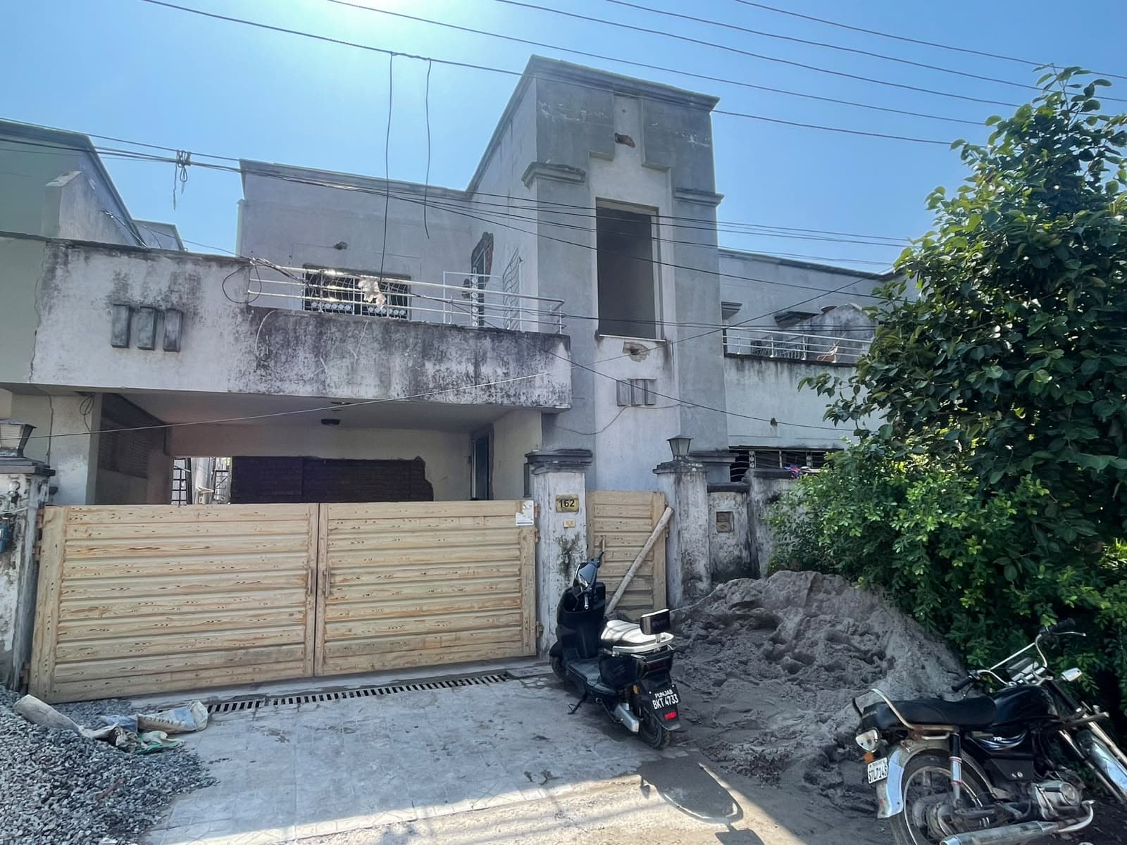 House #162 from the street, renovation under way