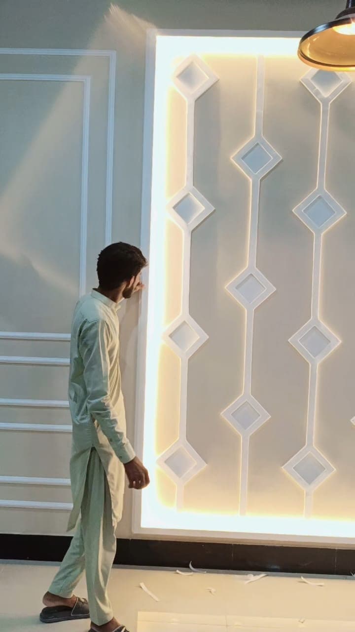 A lit wall feature with diamond insets and a glowing border