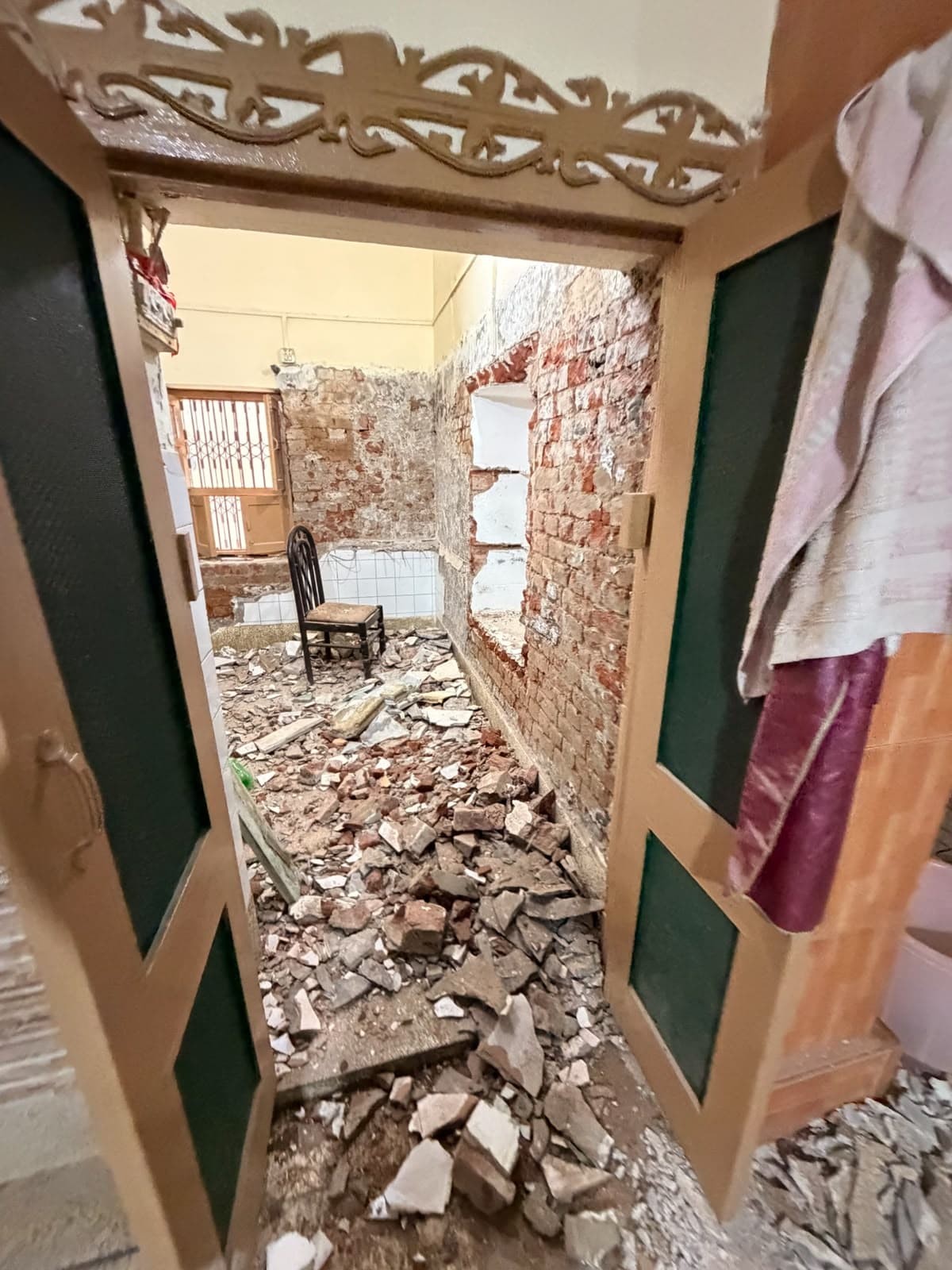 Looking into the stripped kitchen through the doorway