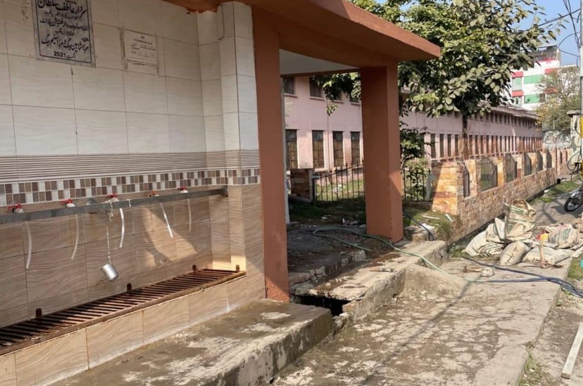 Water filtration plant with a broken concrete step over an open drain