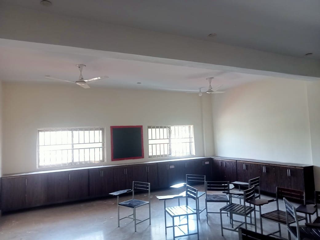 Another finished classroom with fresh cream walls and cabinets along one side