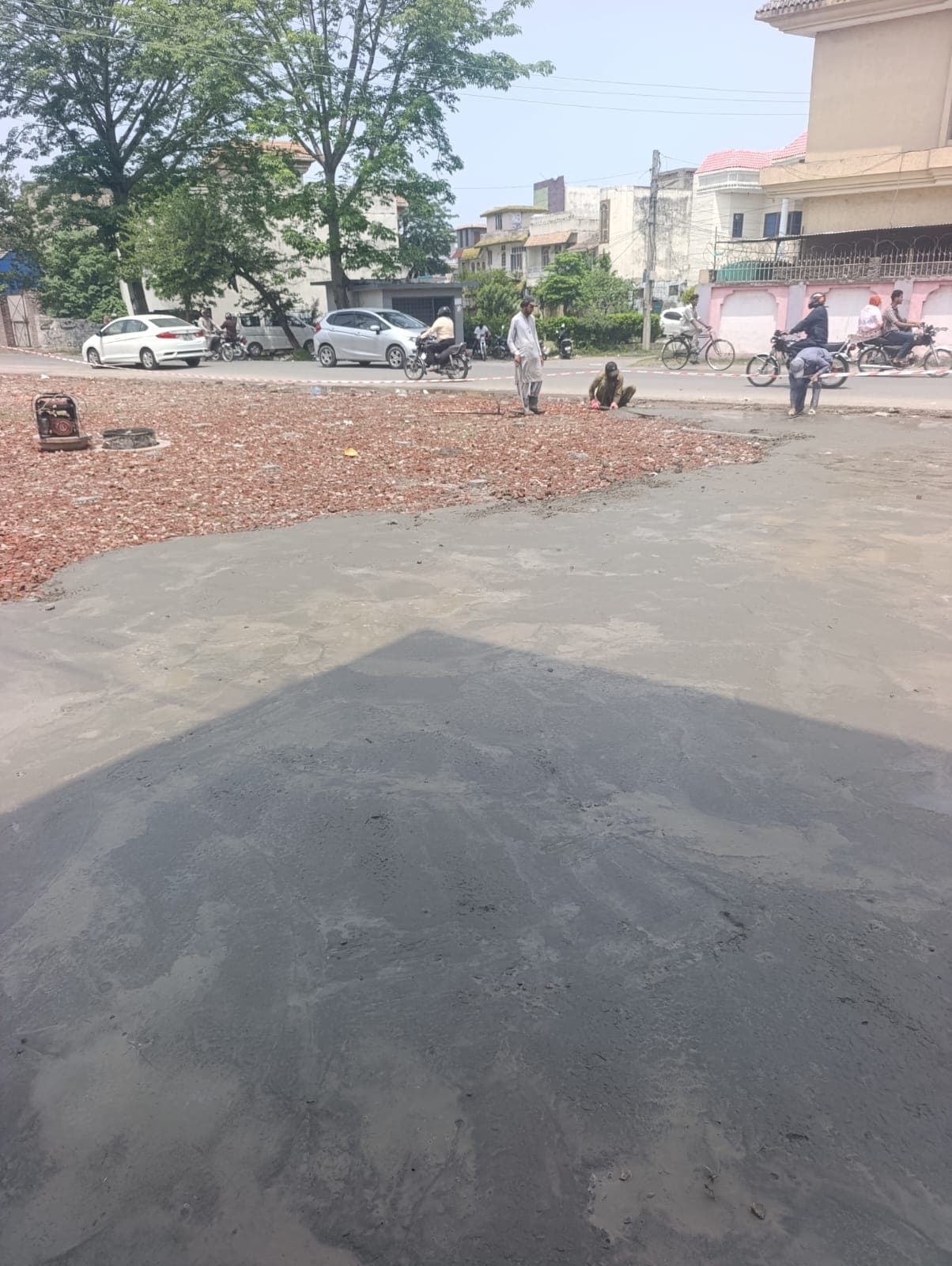 Fresh concrete poured up to the edge of the brick base