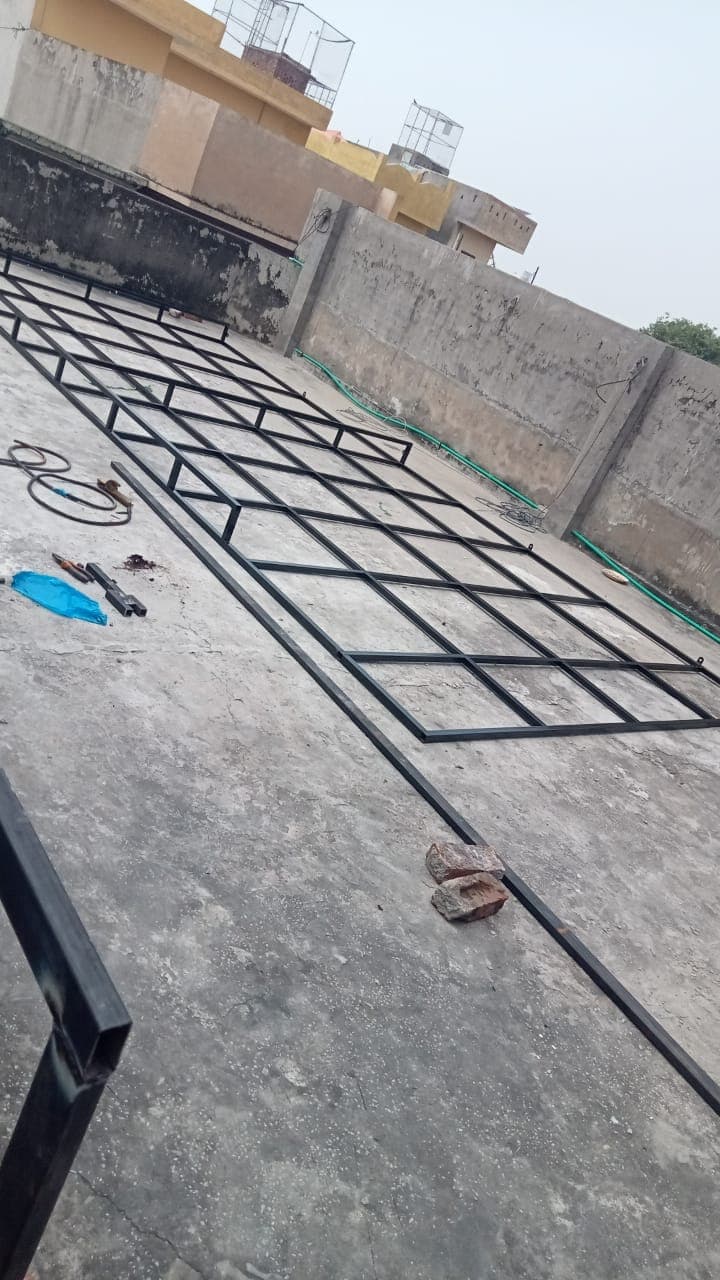 A welded steel lattice frame laid out on a rooftop