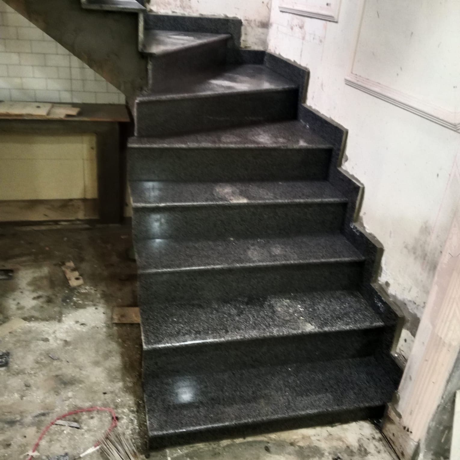 The same granite staircase from below, finished up to the landing