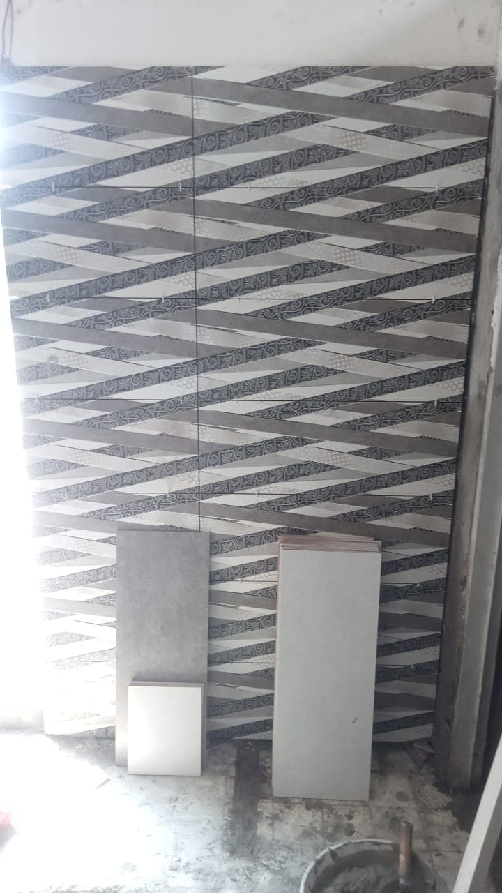 A feature wall of black and white zigzag tiles